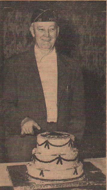 Photo of Legionnaire Jerry Hodson of Pomeroy cutting anniversary cake
