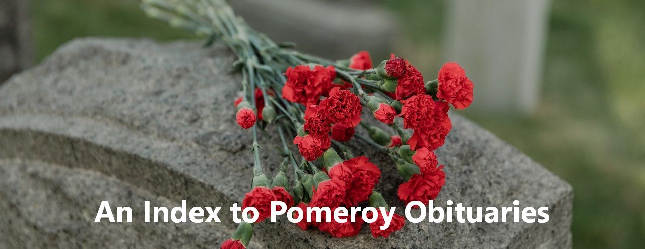 Image of flowers on a grave stone