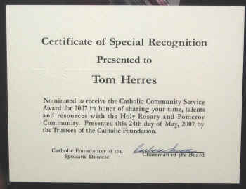 Certificate presented to Tom Herres for community service