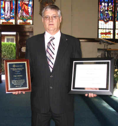 Tom Herres of Pomeroy holding his awards
