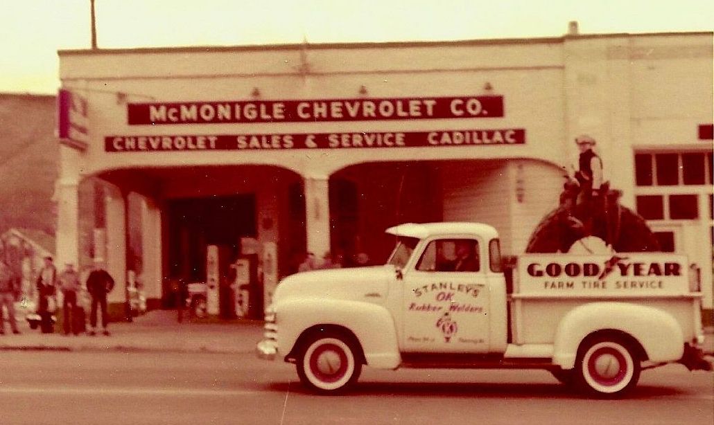 Stanley's OK Rubber Welders truck in fron of McMonigle Chevrolet on Main street, Pomeroy, Washington, 1951 Pioneer Day parade
