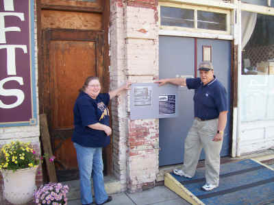Adams-Gordon and Herres admiring the new Historic District plaques